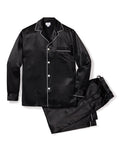 The Mens Silk Pajama Set in Black by Petite Plume is crafted from luxurious mulberry silk and features white piping. This set includes a long-sleeve button-up shirt with a chest pocket and matching elastic-waist pants, combining elegance and comfort effortlessly.