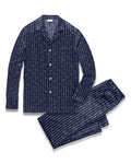 Men’s Silk Pajama Set in Nautical Knots featuring a navy blue button-up long-sleeve top and matching pants, both accented with a white horizontal stripe pattern.