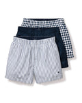 The Mens Twill 3 Pack Boxers in Navy by Petite Plume include three pairs: one with blue and white stripes in woven cotton twill, a solid dark blue pair, and a classic fit with blue and white checks. Each features an elastic waistband.