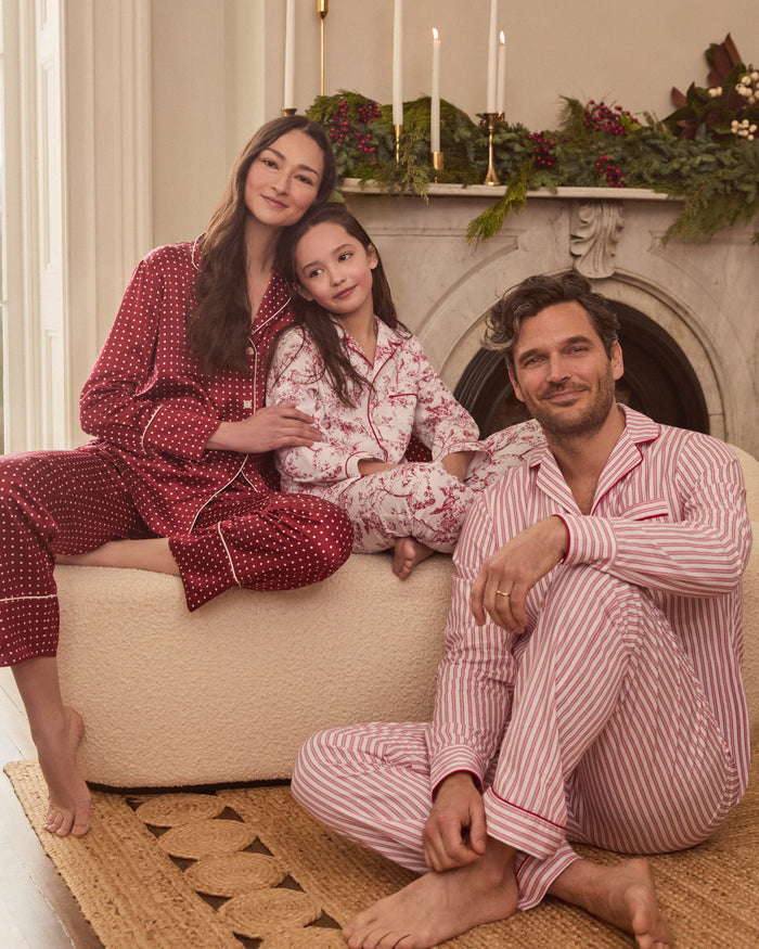 Close-up of Petite Plumes Mens Twill Pajama Set in Antique Red Ticking, featuring pink and white vertical stripes, a collar, a pocket with matching trim, and a single white button. Perfect for cozy relaxation.