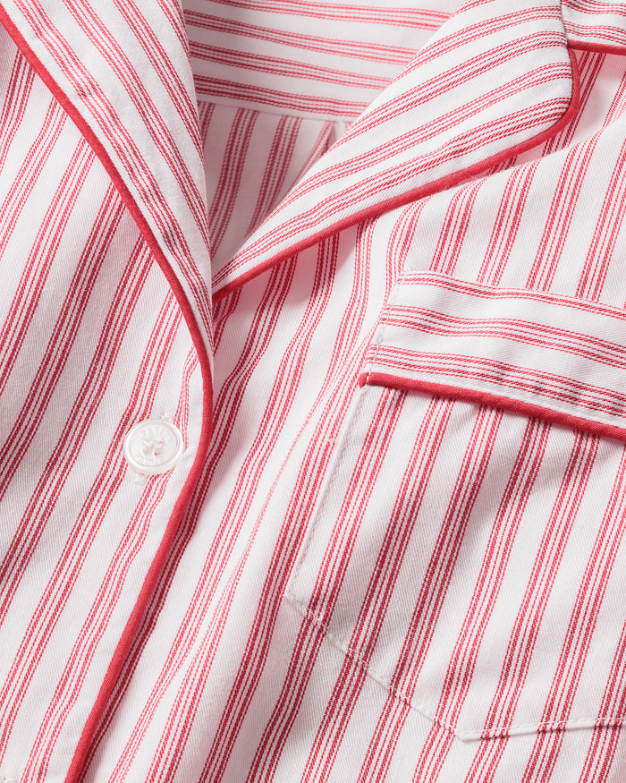 Close-up of Petite Plumes Mens Twill Pajama Set in Antique Red Ticking, featuring pink and white vertical stripes, a collar, a pocket with matching trim, and a single white button. Perfect for cozy relaxation.