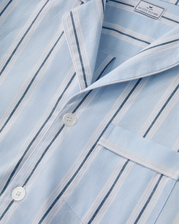 Close-up of the Men’s Twill Pajama Set in Coastal Stripe, featuring a button-up shirt with a collar, pocket, and light blue, white, and dark blue stripes.