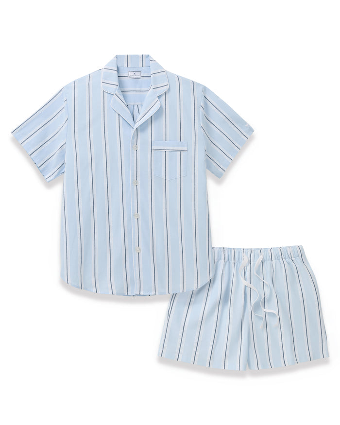 Men’s Twill Pajama Short Set in Coastal Stripe features a light blue, short-sleeve button-up top with vertical white and navy stripes and a chest pocket. The matching shorts have an elastic waistband with a white drawstring.