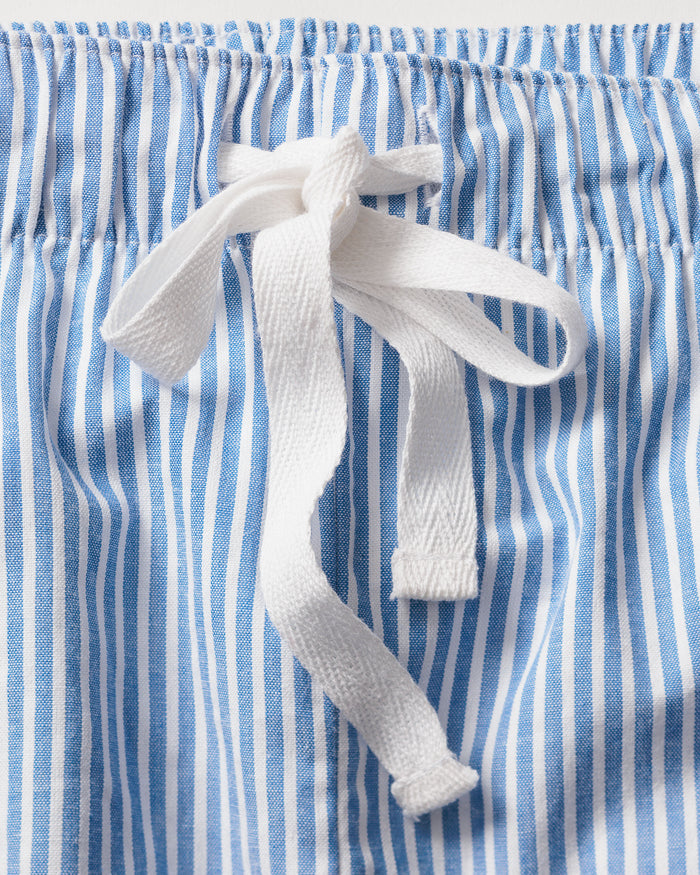 A close-up of the Mens Twill Blue Seersucker Short Set with Eiffel Tower by Petite Plume shows blue and white vertically striped shorts with a white drawstring bow at the waistband.