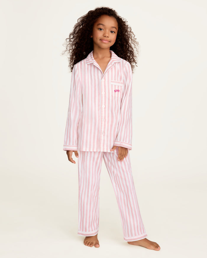 Petite Plume x Eloise Kid's Twill Pajama Set in Eloise Classic Stripe features pink and white stripes.