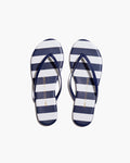 The Petite Plume x TKEES Lily Sandal in Cabana Stripe features navy blue and white horizontal stripes on the footbed with navy straps, shown side by side on a white background.