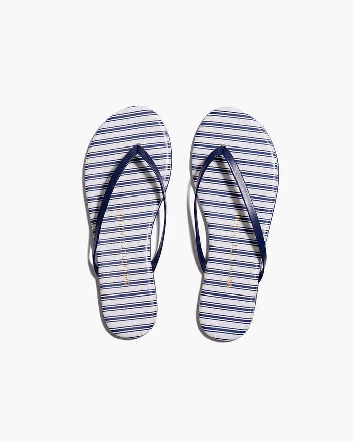 The Petite Plume x TKEES Lily Sandal in Navy French Ticking features blue and white horizontal stripes with dark blue straps, displayed side by side on a white background.