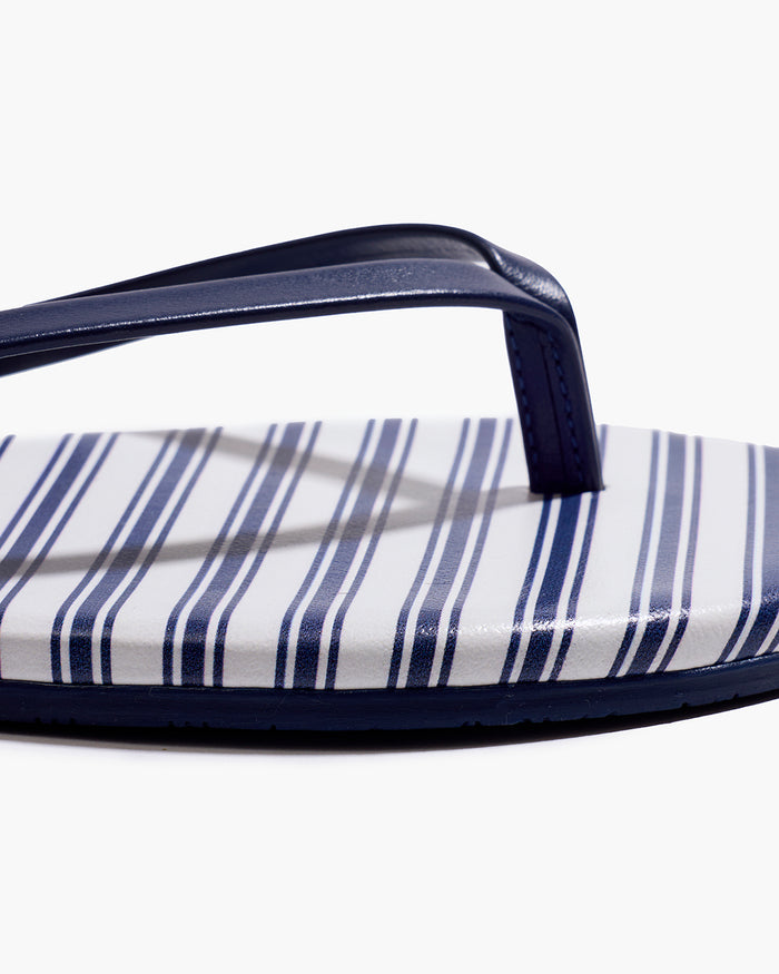 The Petite Plume x TKEES Lily Sandal in Navy French Ticking features blue and white horizontal stripes with dark blue straps, displayed side by side on a white background.