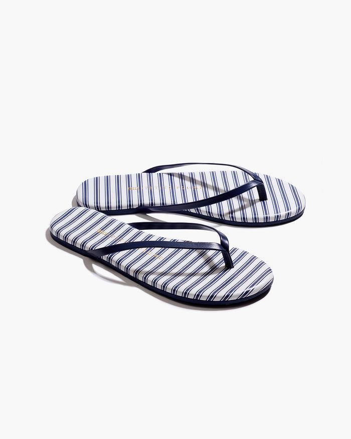 The Petite Plume x TKEES Lily Sandal in Navy French Ticking features blue and white horizontal stripes with dark blue straps, displayed side by side on a white background.