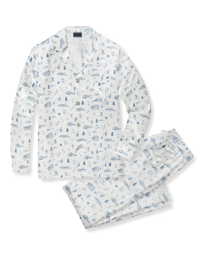 Petite Plume x White Elephant Men’s Silk Pajama Set in white, adorned with blue nautical-themed illustrations, featuring a long-sleeve button-up shirt and matching pants, both folded neatly on a white background.