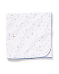 The Pima Baby Blanket in Letters and Lullabies features a folded white design with a blue stitched edge, adorned with small, colorful animal and letter prints scattered across the fabric.