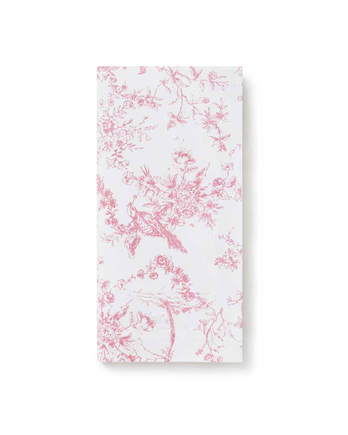 A neatly folded stack of Signature Twill Napkins in Pink Timeless Toile, featuring a delicate pink floral and branch pattern, displayed on a plain white background.