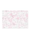 Signature Twill Placemats in Pink Timeless Toile feature a rectangular white cloth with a delicate pink floral and bird toile pattern.