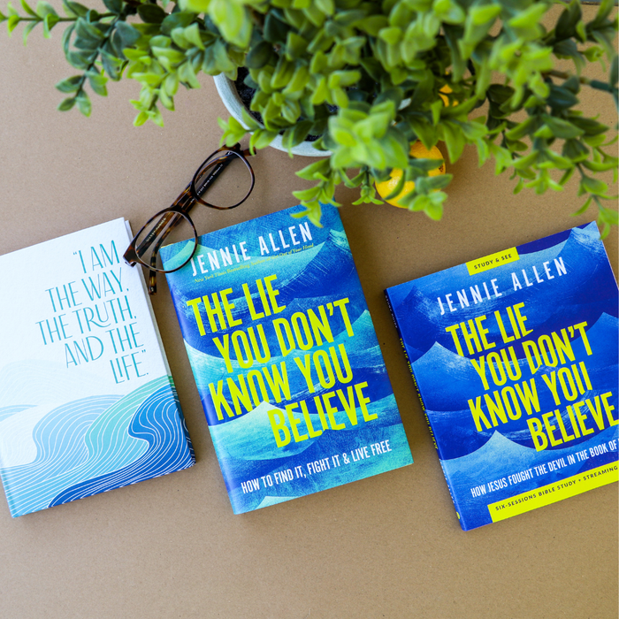 Two books titled 'The Lie You Don't Know You Believe' by Jennie Allen on a surface with a plant in the background.