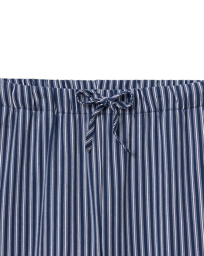 The Olivia Wide Leg Pima Pajama Set in Admiral Ticking features navy blue and white striped bottoms with an elastic waistband and a tied drawstring bow at the center front.