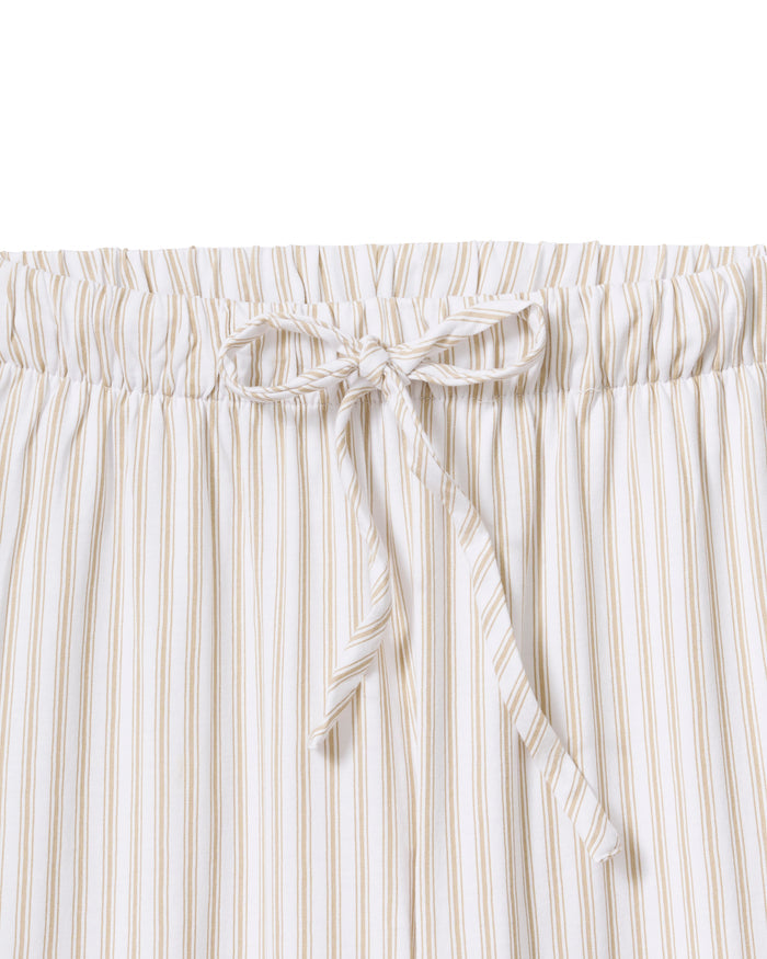 The Olivia Wide Leg Pima Pajama Set in Camel Ticking features light-colored, long-sleeve striped pajamas with brown buttons and matching drawstring pants, displayed flat on a white background.