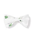 The Dog Twill Bow Tie in Shamrocks by Petite Plume features small green shamrocks on a crisp white background, perfect for adding holiday flair to your pets wardrobe.