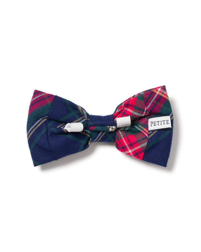 The Windsor Tartan dog bow tie by Petite Plume showcases festive, colorful red, green, and blue plaid patterns with a small white PETITE label on one side.