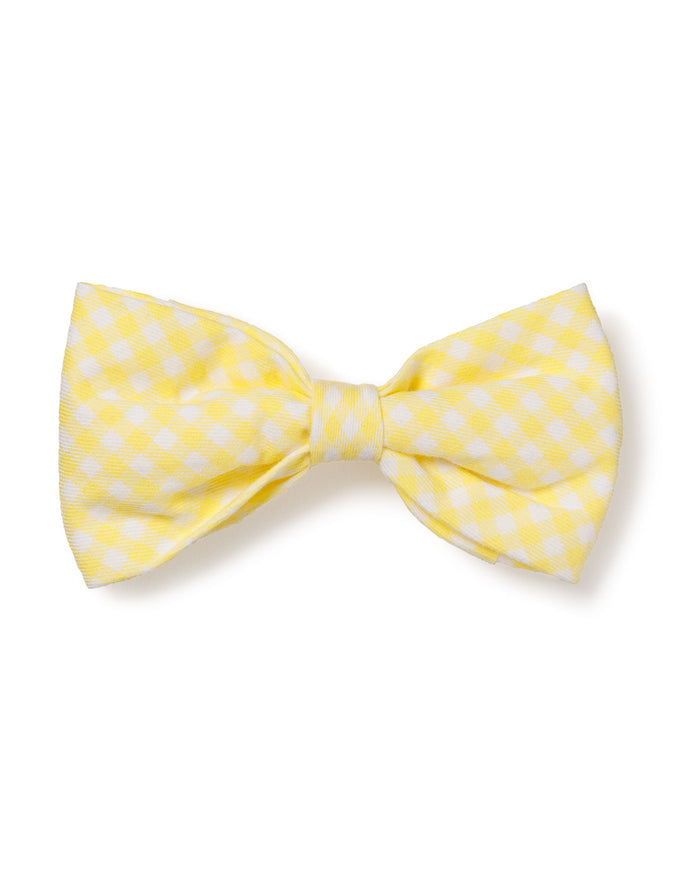 The Dog Twill Bow Tie in Yellow Gingham by Petite Plume is a cheerful checkered dog accessory, perfect for a festive look.