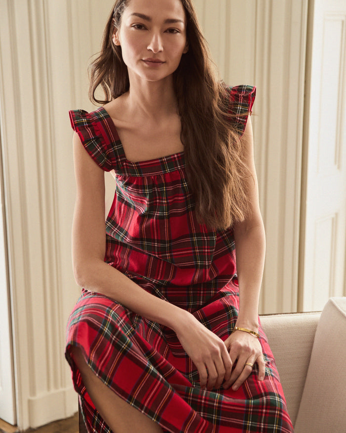 The Women's Brushed Twill Clara Nightgown in Imperial Tartan features a sleeveless red plaid design with green, yellow, and white stripes, ruffled shoulder straps, and a loose gathered bodice for a festive holiday look.