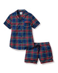 A close-up of Petite Plumes Womens Brushed Cotton Short Sleeve Short Set in Windsor Tartan showcases a blue, red, and green plaid fabric with a button emblem and contrasting piping on the pocket, epitomizing the elegance of luxury cotton sleepwear.