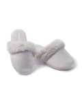 A pair of Womens Faux Fur Trim Slippers in light gray by Petite Plume, showcasing plush comfort with soft fur trim, is displayed on a white background. One slipper stands upright while the other rests elegantly on its side.