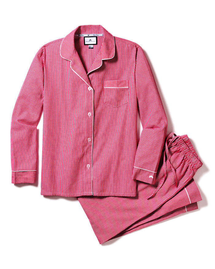 The Womens Flannel Pajama Set in Red Mini Gingham by Petite Plume features a long-sleeve button-up top with a chest pocket and elegant white piping, perfectly paired with matching pants for timeless luxury.