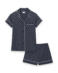 Women’s Lightweight Pima Short Sleeve Short Set in Captain’s Compass, featuring a navy blue geometric print with white piping along the collar, front, sleeves, pocket, and shorts.