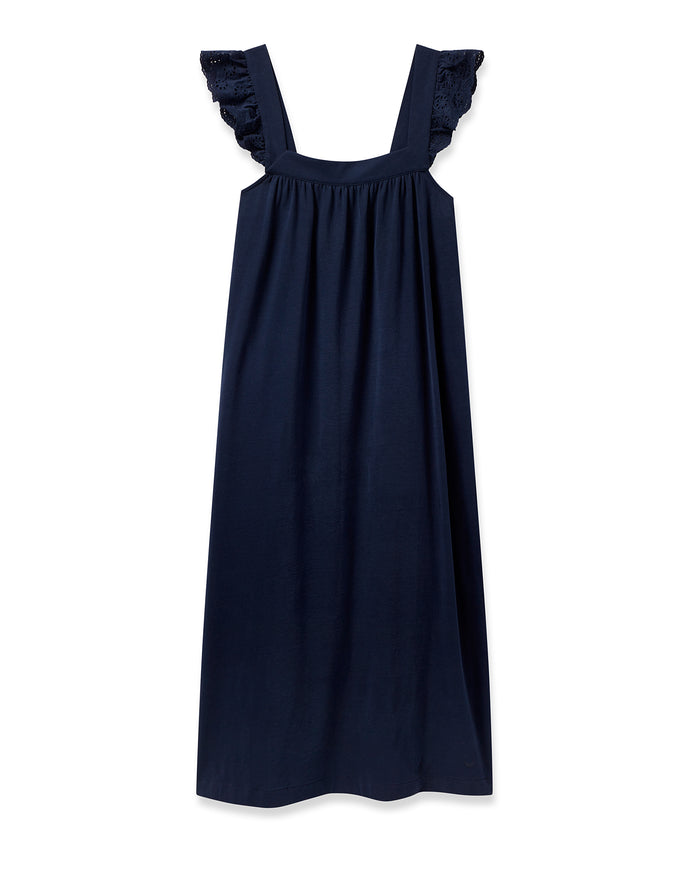 The Womens Pima Clara Nightgown in Navy by Petite Plume features wide shoulder straps and luxurious ruffled details. Made with fine Peruvian Pima cotton, it has a loose silhouette and gathered neckline, elegantly displayed on a plain white background.