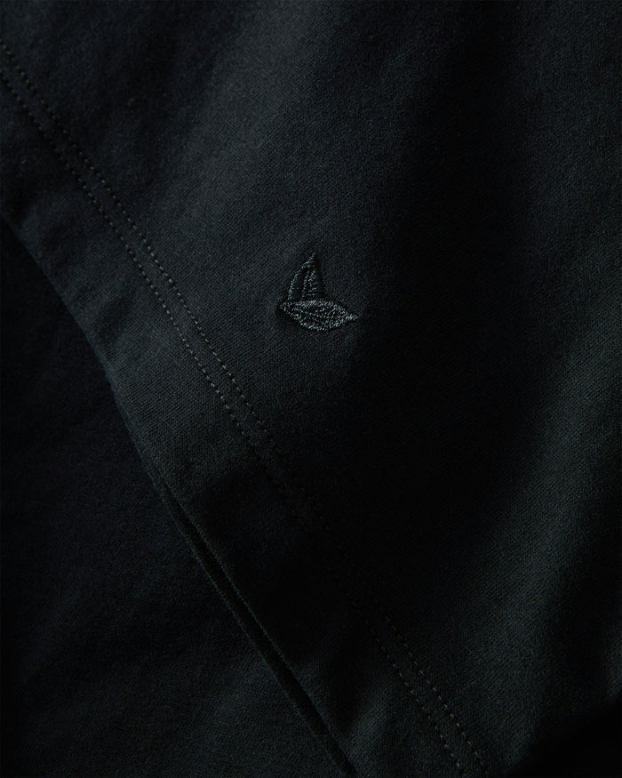 A black crew neck t-shirt made from pima cotton, displayed against a white background.