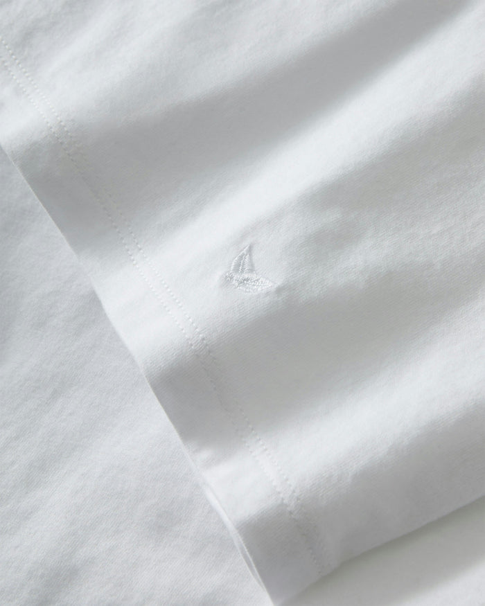 A white crew neck t-shirt made of pima cotton, displayed against a plain background.