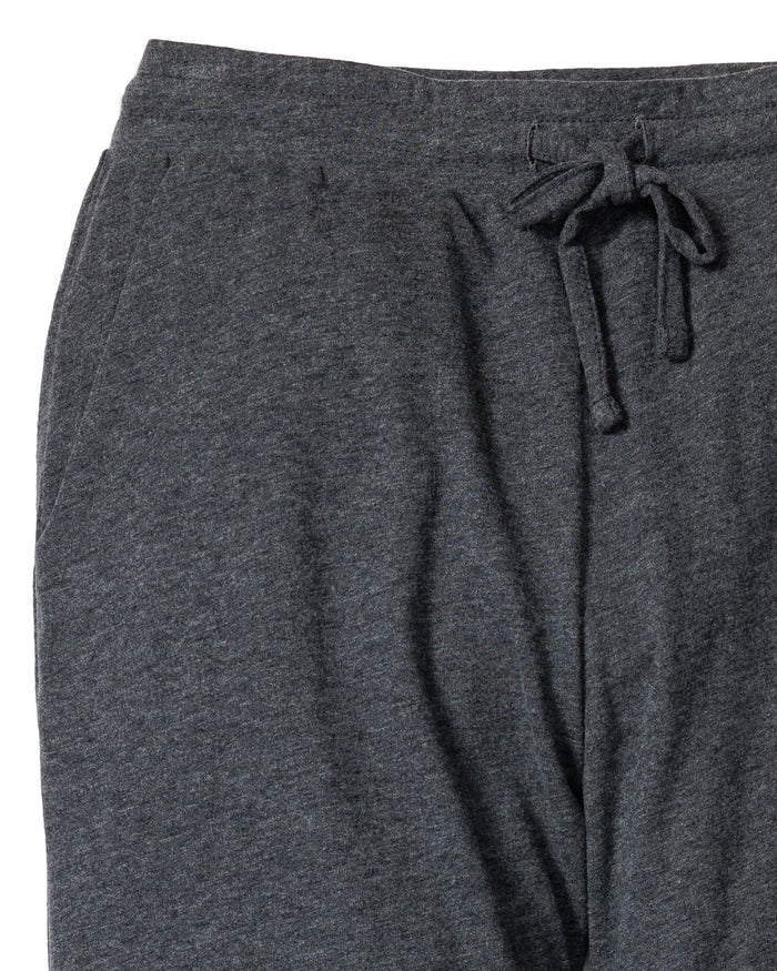 A close-up of Petite Plumes Womens Pima Lounge Pants in Dark Heather Grey highlights an elastic waistband with drawstring and side pocket, crafted from 100% Peruvian Pima cotton. The soft fabric is perfect for luxury sleepwear or casual wear.