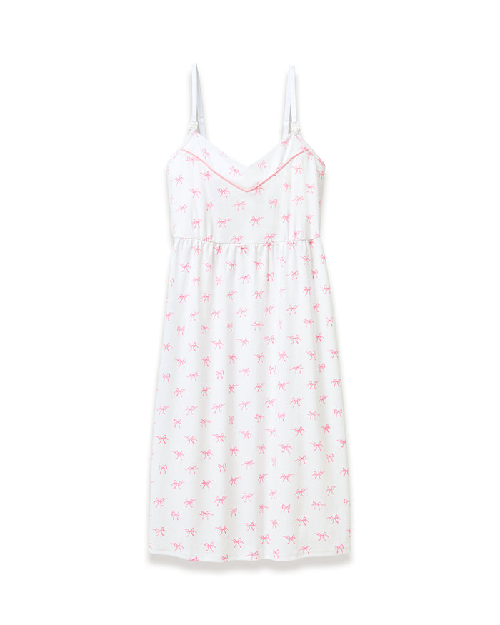 The Women's Pima Maternity Nightgown in Blushing Bows is a white sleeveless spaghetti strap dress with a fitted bust, slightly flared skirt, and an all-over print of small pink bows.