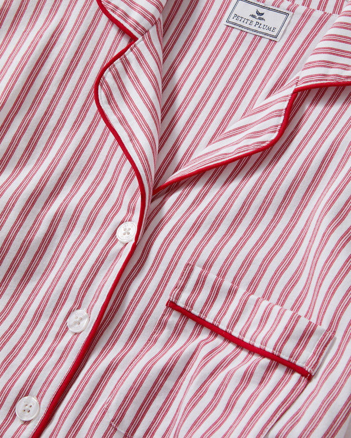 The Women's Pima Maternity Nightshirt in Antique Red Ticking features red and white vertical stripes, a front pocket, white buttons, and red piping on the collar, cuffs, and pocket edge.