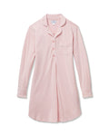 The Women's Pima Maternity Nightshirt in Pink features long sleeves, white piping, a collar, front buttons, single chest pocket, and a curved hem in soft, comfortable fabric.