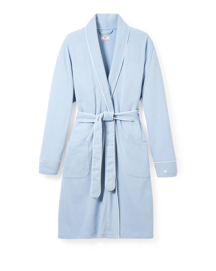 The Petite Plume Womens Pima Maternity Robe in Periwinkle offers a shawl collar, long sleeves, and two front pockets. It features white piping along the edges, a matching fabric belt at the waist, and is crafted from soft pima cotton for comfort and elegance.