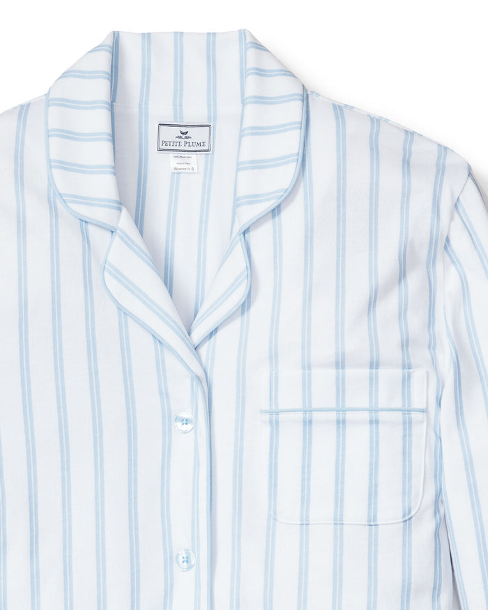 The Womens Pima Nightshirt in Periwinkle and White Stripe by Petite Plume features a notched collar, button-down front, and breast pocket, crafted from luxurious Peruvian Pima cotton for ultimate comfort.
