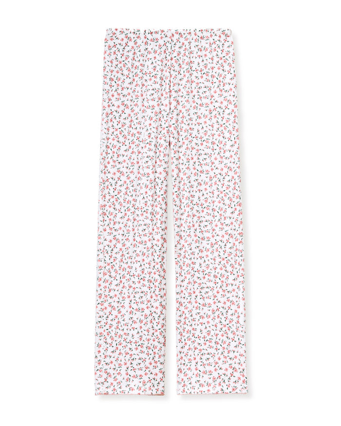 A woman stands barefoot against a plain background, wearing the Women's Pointelle Pant in Pink Floral.