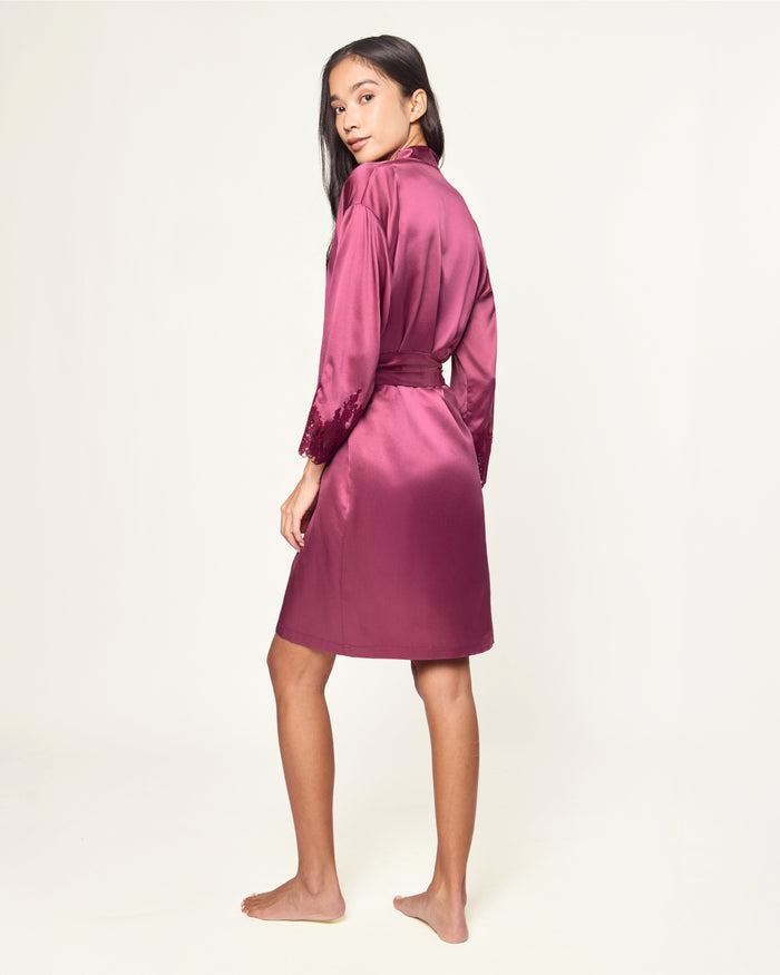 The Women's Silk Lace Robe in Rosewood features a matching belt and lace-trimmed sleeves, shown flat on a white background.