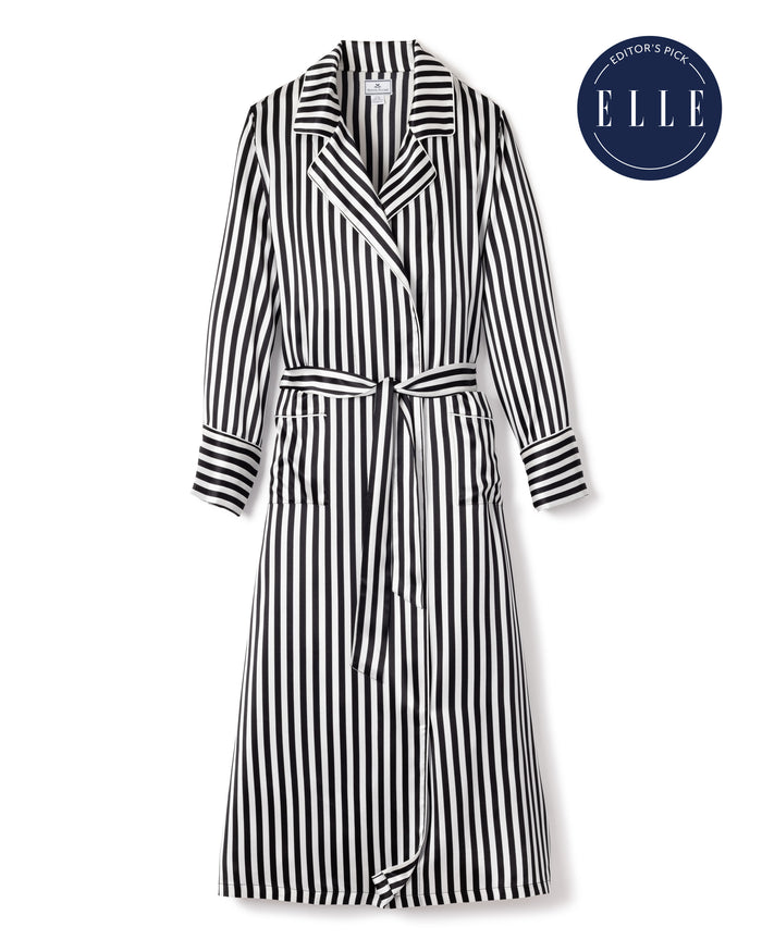 The Womens Silk Long Robe in Bengal Stripe by Petite Plume, from the Cabaret Collection, features a black and white print with a belted waist and buttoned front. Its highlighted with an Editors Pick badge with ELLE on a dark blue circular background in the top right corner.