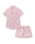 The Women's Silk Short Sleeve Short Set in Blush Tide features a matching pink button-up top and elastic-waist shorts, both adorned with a light purple geometric fan pattern.