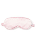 The Womens Silk Sleep Mask in Pink by Petite Plume features a soft, cushioned texture and a striped elastic strap, crafted from pure silk for ultimate comfort.