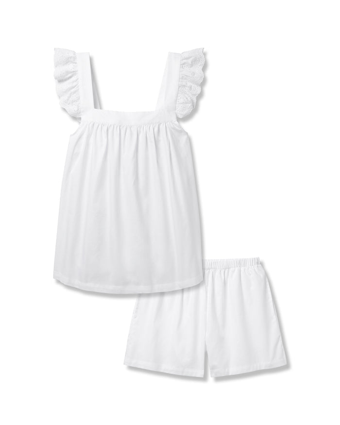 The Womens Twill Clara Short Set in White by Petite Plume features a sleeveless top with ruffled straps and matching shorts, both crafted from premium cotton. Displayed on a plain background, it represents luxurious sleepwear for ultimate comfort.