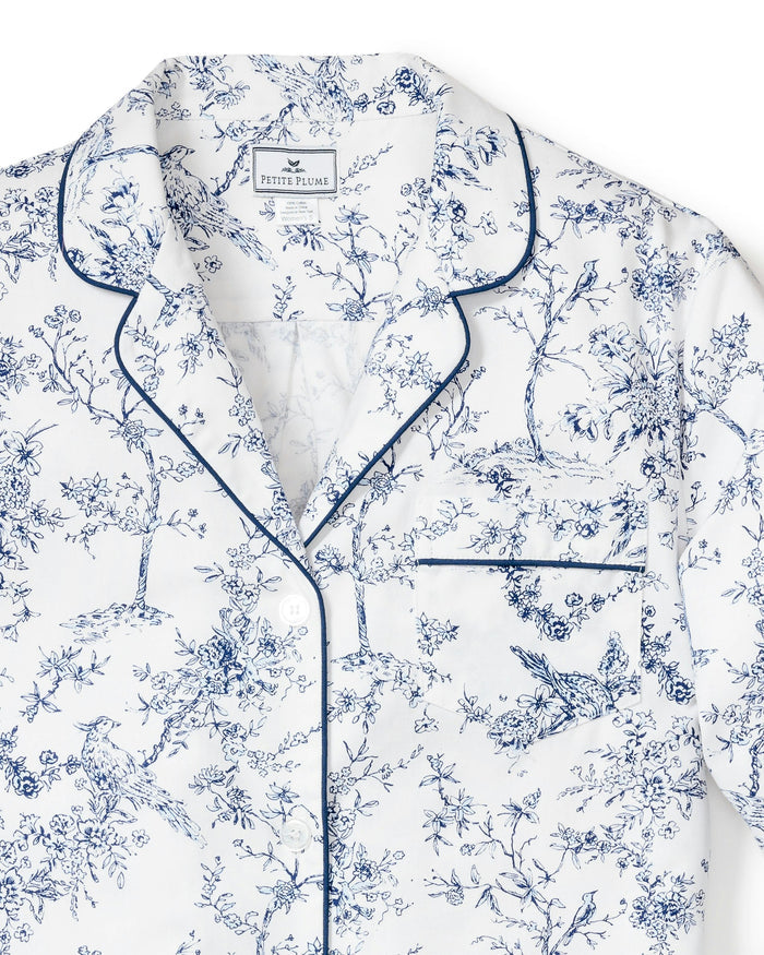 Blue and white floral pajama set on a white background