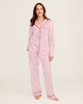 The Womens Twill Pajama Set in Antique Red Ticking by Petite Plume features a white shirt with red vertical stripes, front pocket, and button closure. Made from soft, lightweight fabric, the classic pattern offers comfort for sleepwear or casual wear.