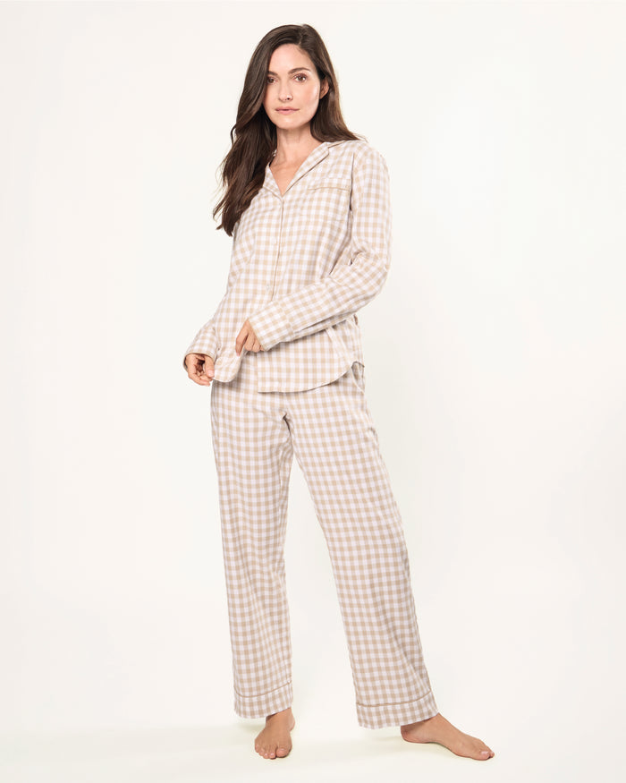 The Women's Twill Pajama Set in Camel Gingham features a beige and white check long-sleeve, button-up top with chest pocket and matching drawstring pants, displayed neatly on a white background.