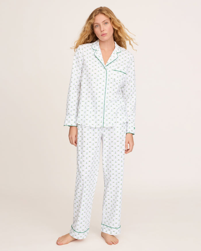 The Women's Twill Pajama Set in Fairway Stripe features a neatly folded white set with green stripes, including a long-sleeve button-up top with a chest pocket and matching drawstring pants.