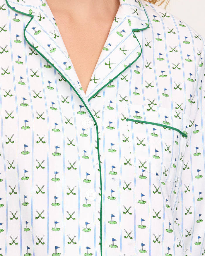 The Women's Twill Pajama Set in Fairway Stripe features a neatly folded white set with green stripes, including a long-sleeve button-up top with a chest pocket and matching drawstring pants.