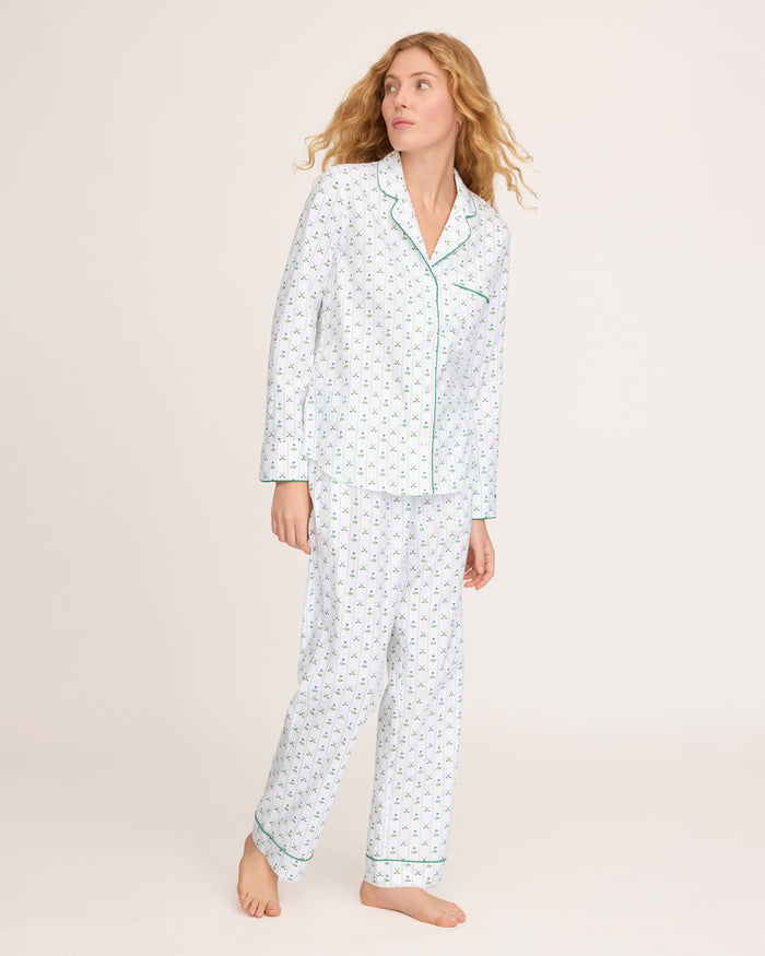 The Women's Twill Pajama Set in Fairway Stripe features a neatly folded white set with green stripes, including a long-sleeve button-up top with a chest pocket and matching drawstring pants.