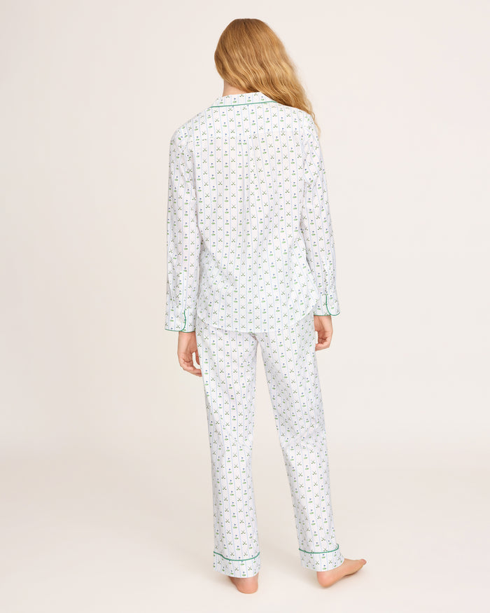 The Women's Twill Pajama Set in Fairway Stripe features a neatly folded white set with green stripes, including a long-sleeve button-up top with a chest pocket and matching drawstring pants.